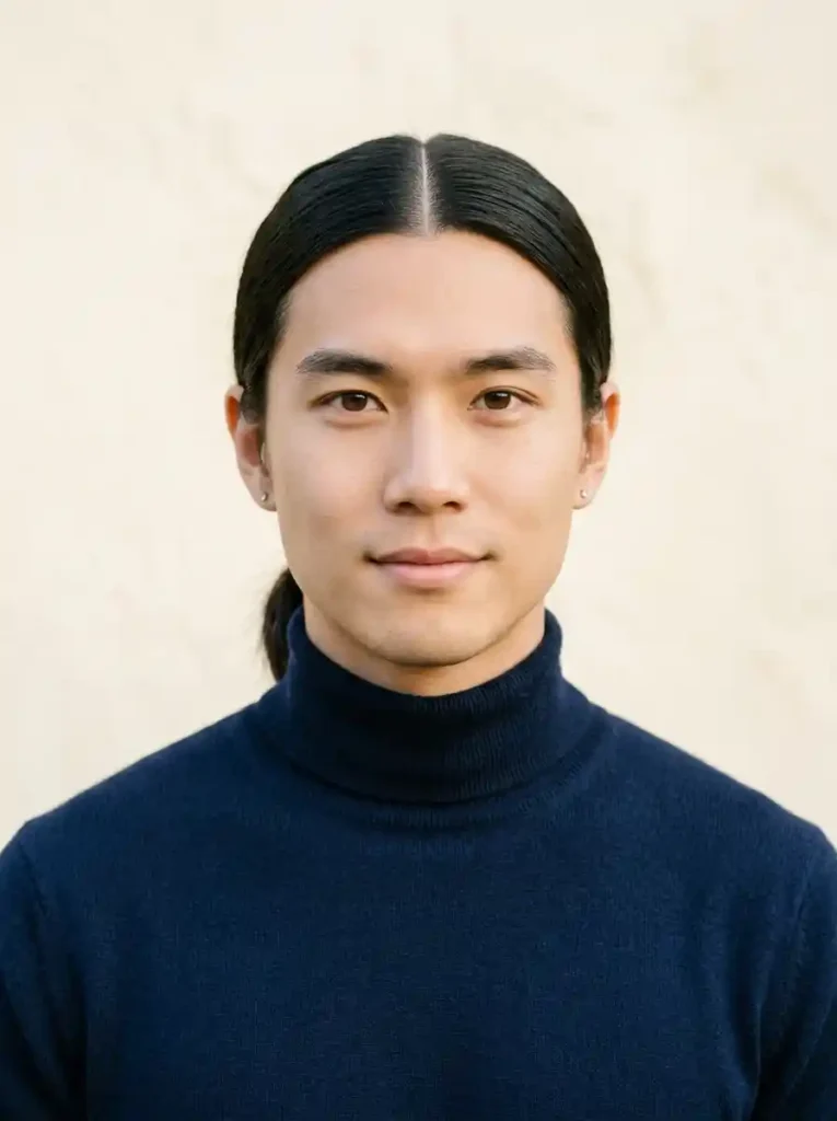 21 Mens Ponytail Hairstyles That Blend Style and Confidence 8 The Ponytail With Middle Part — Balanced and Deliberately Modern